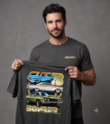 A man wearing a dark gray t-shirt holds up a larger version of the same graphic tee. The graphic features stacked illustrations of classic cars in blue, silver, and green, with the word 'BOWLER' in gold and white.