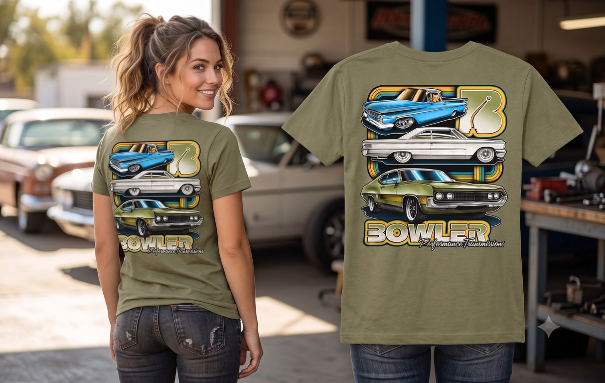 An olive green graphic t-shirt featuring three classic muscle cars and the name 'BOWLER' in a bold font, shown both on a mannequin torso and modeled by a woman in a garage setting with vintage cars in the background.